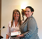 Principal/Director of Property Management Tina Olson, RPA FMA, with Property Manager of the Year Linda Montes-Cota